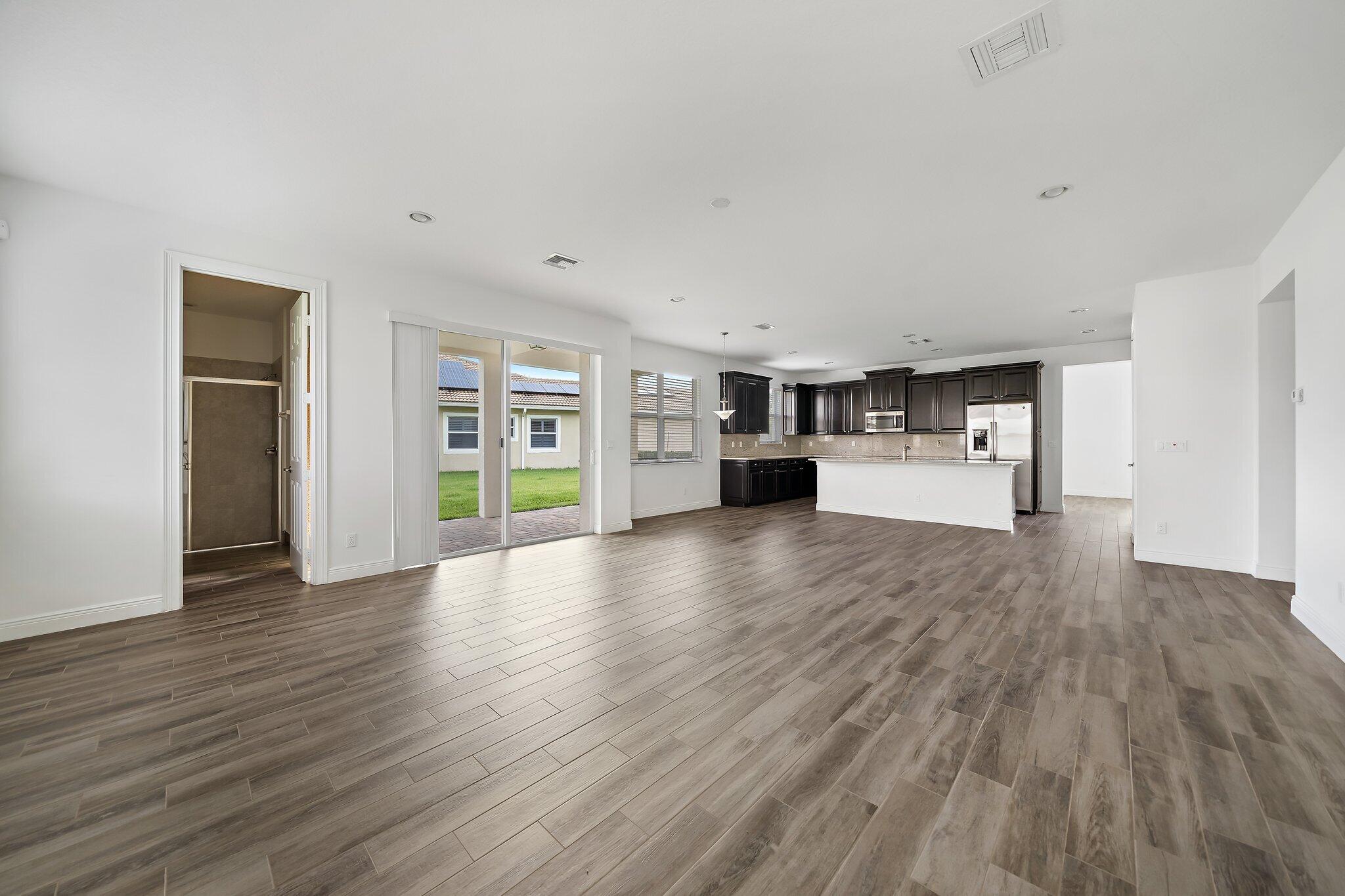 434 Rudder Cay Way Jupiter, FL 33458 - Photo 16 of 52 a view of empty room with wooden floor