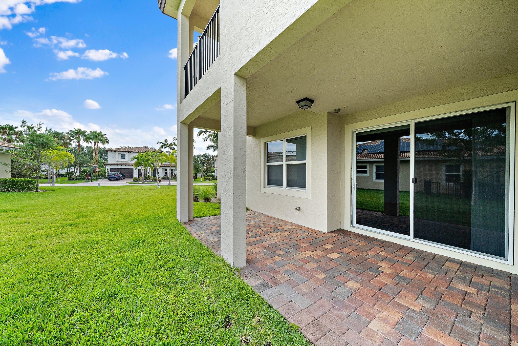 434 Rudder Cay Way Jupiter, FL 33458 - Photo 19 of 52 a view of a house with a yard