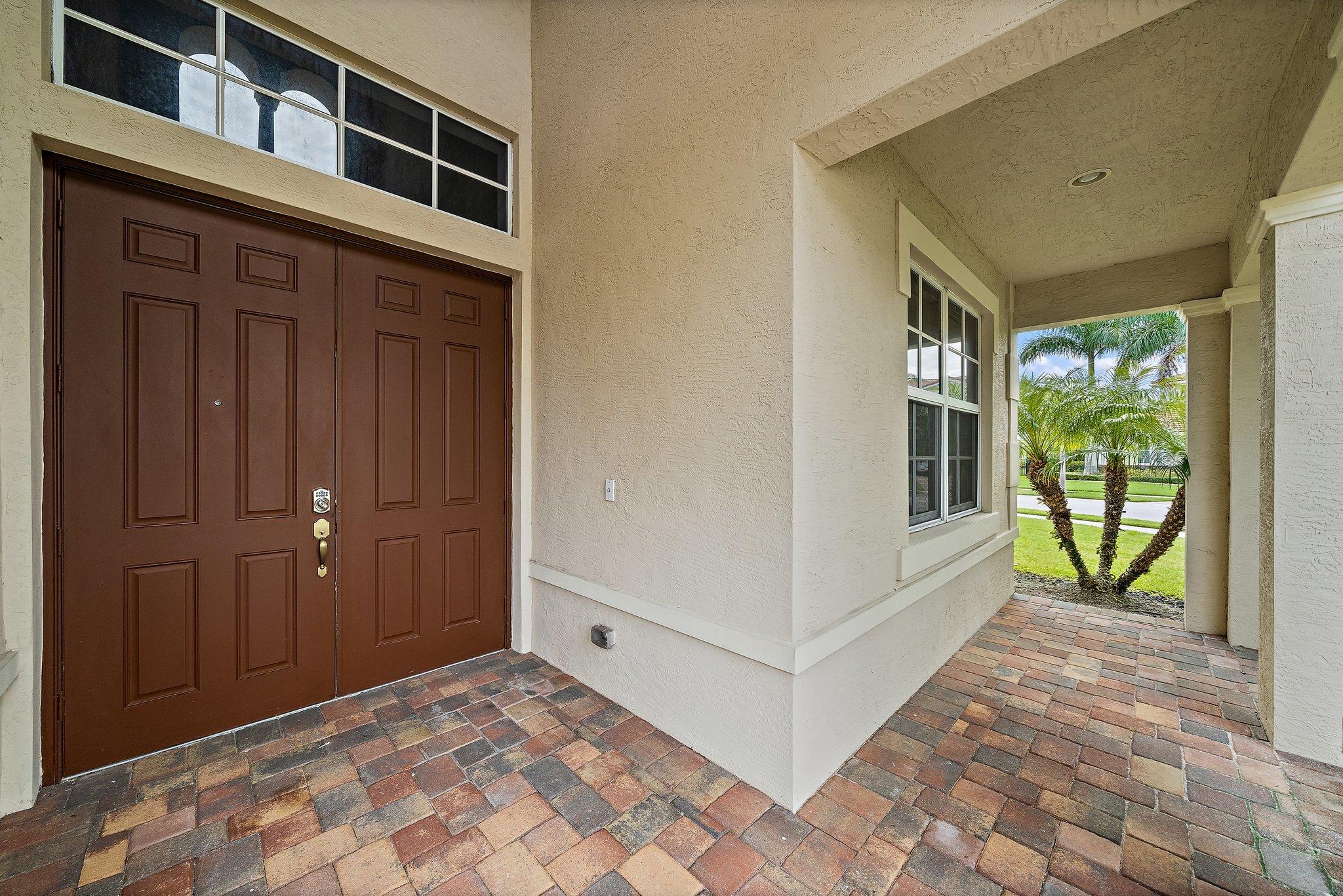 434 Rudder Cay Way Jupiter, FL 33458 - Photo 3 of 52 a view of a entryway door of the house