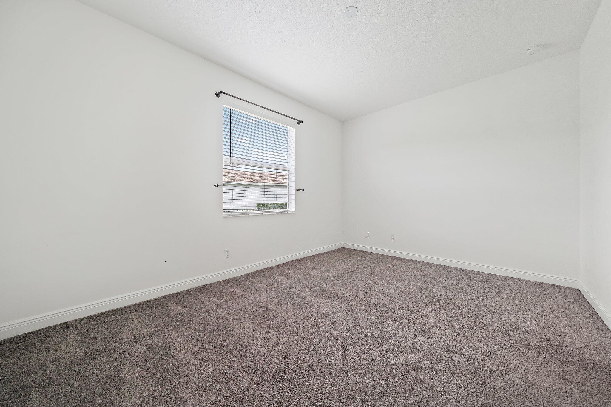 434 Rudder Cay Way Jupiter, FL 33458 - Photo 22 of 52 an empty room with a workbench