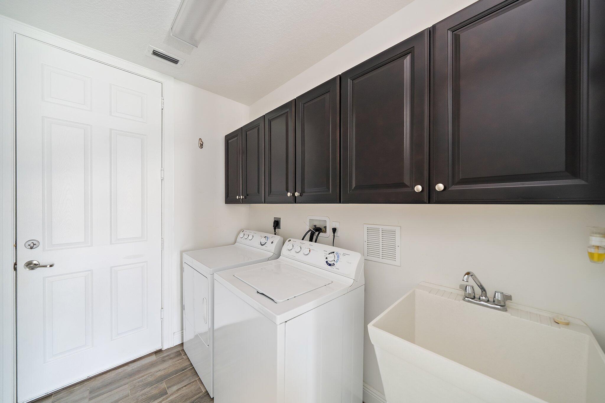 434 Rudder Cay Way Jupiter, FL 33458 - Photo 24 of 52 a bathroom with a sink and a mirror