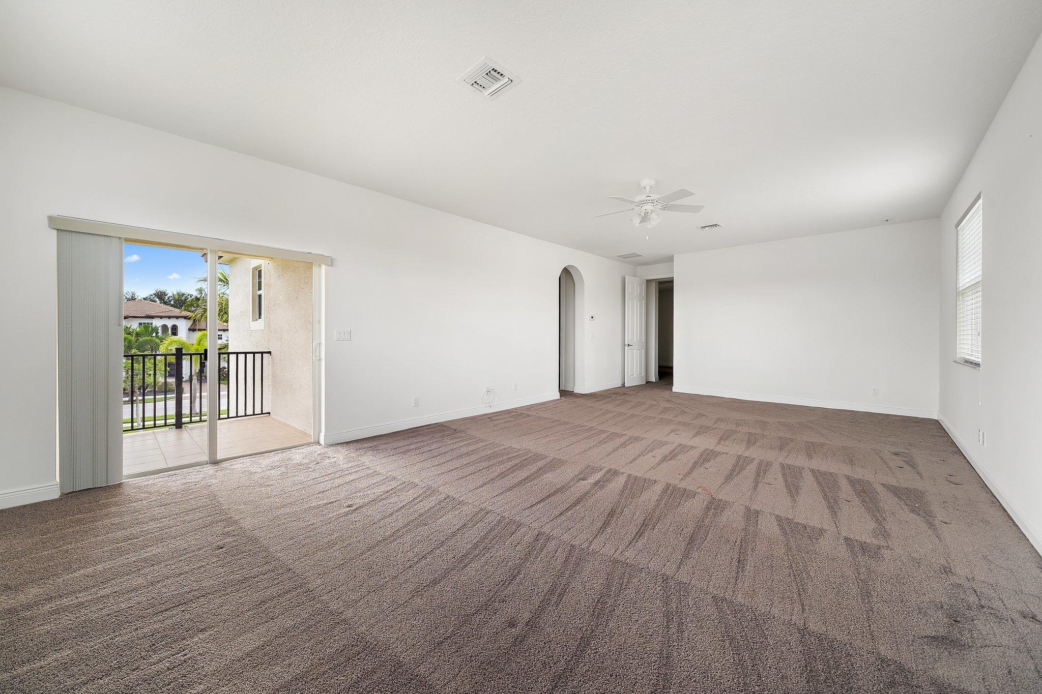 434 Rudder Cay Way Jupiter, FL 33458 - Photo 28 of 52 a view of livingroom with furniture and a ceiling fan