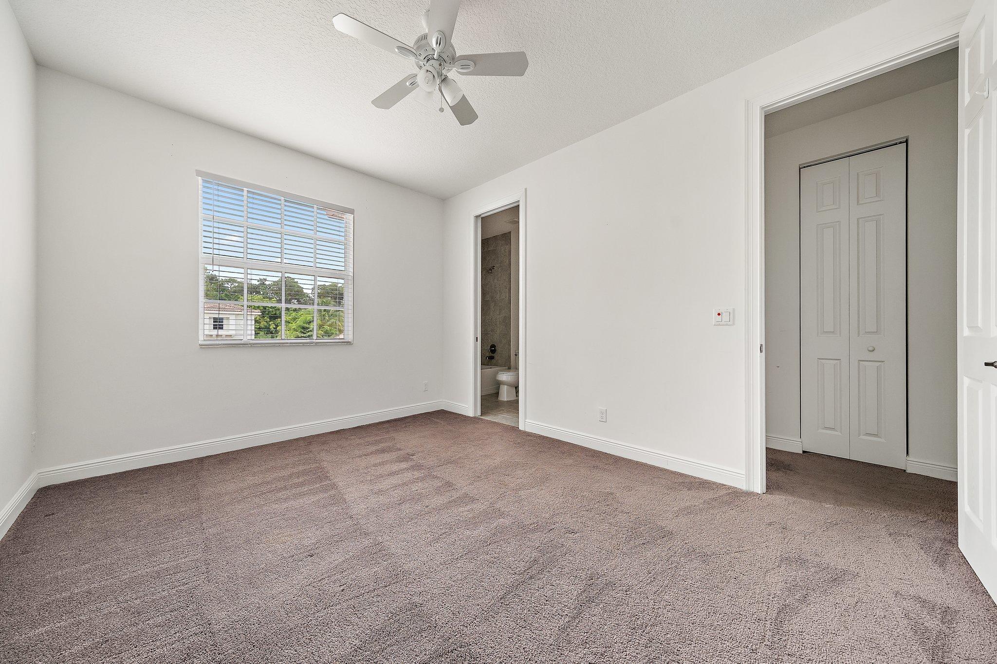 434 Rudder Cay Way Jupiter, FL 33458 - Photo 39 of 52 a view of an empty room with a window