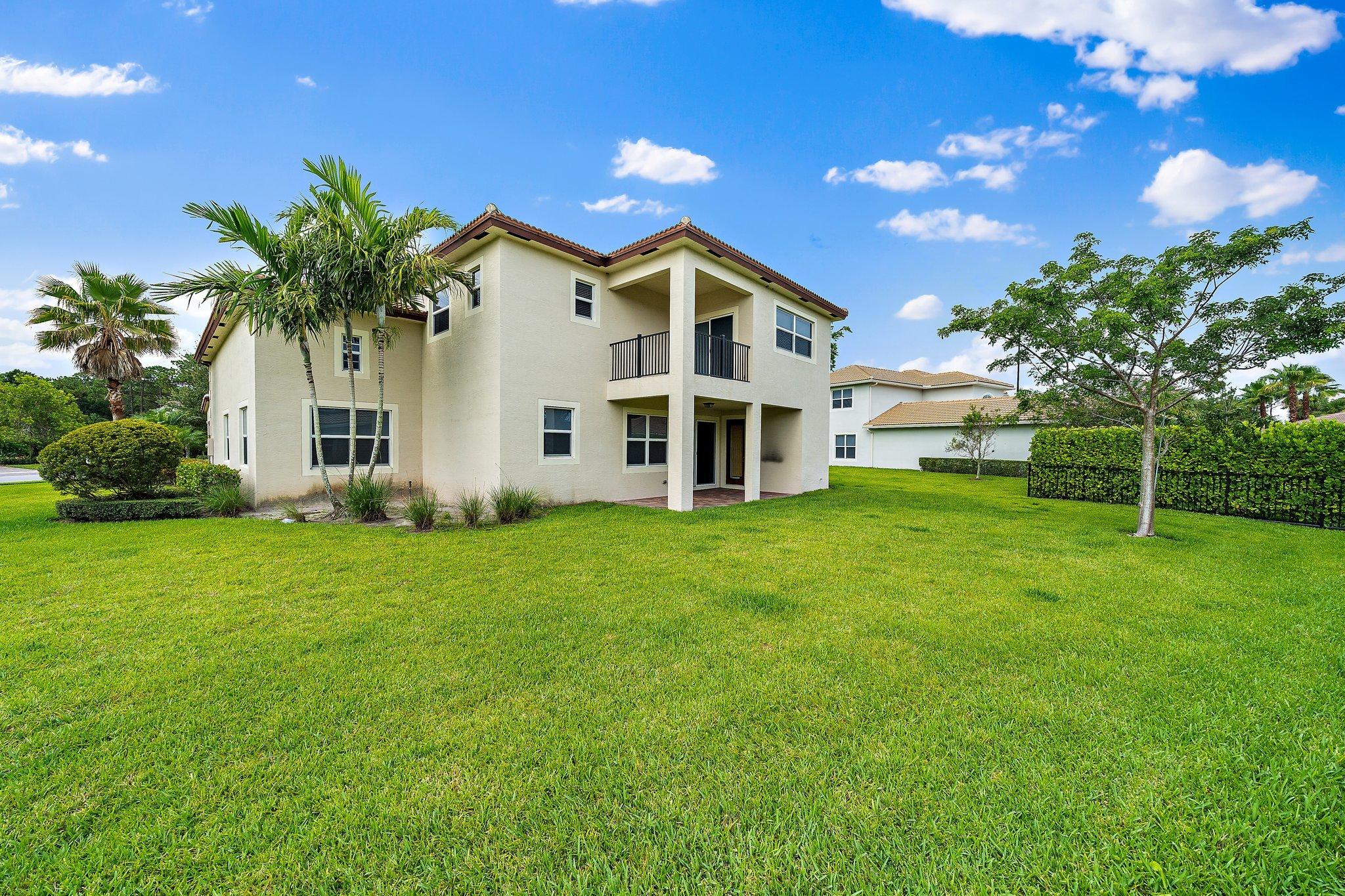 434 Rudder Cay Way Jupiter, FL 33458 - Photo 43 of 52 a front view of a house with a yard