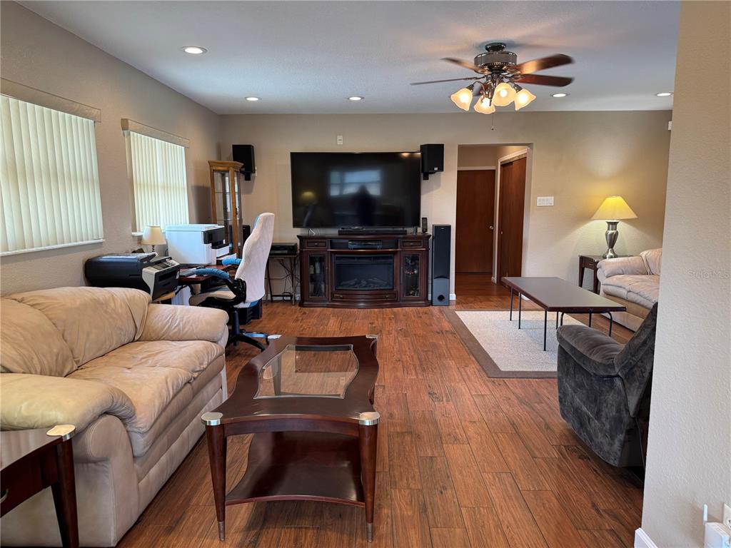 5333 Deeson Road Lakeland, FL 33810 - Photo 12 of 44 a living room with furniture and a flat screen tv