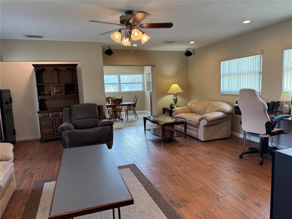 5333 Deeson Road Lakeland, FL 33810 - Photo 15 of 44 a living room with furniture chandelier and a window