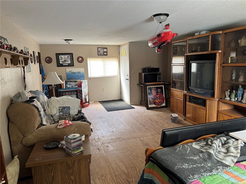 5333 Deeson Road Lakeland, FL 33810 - Photo 17 of 44 a living room with furniture and a flat screen tv