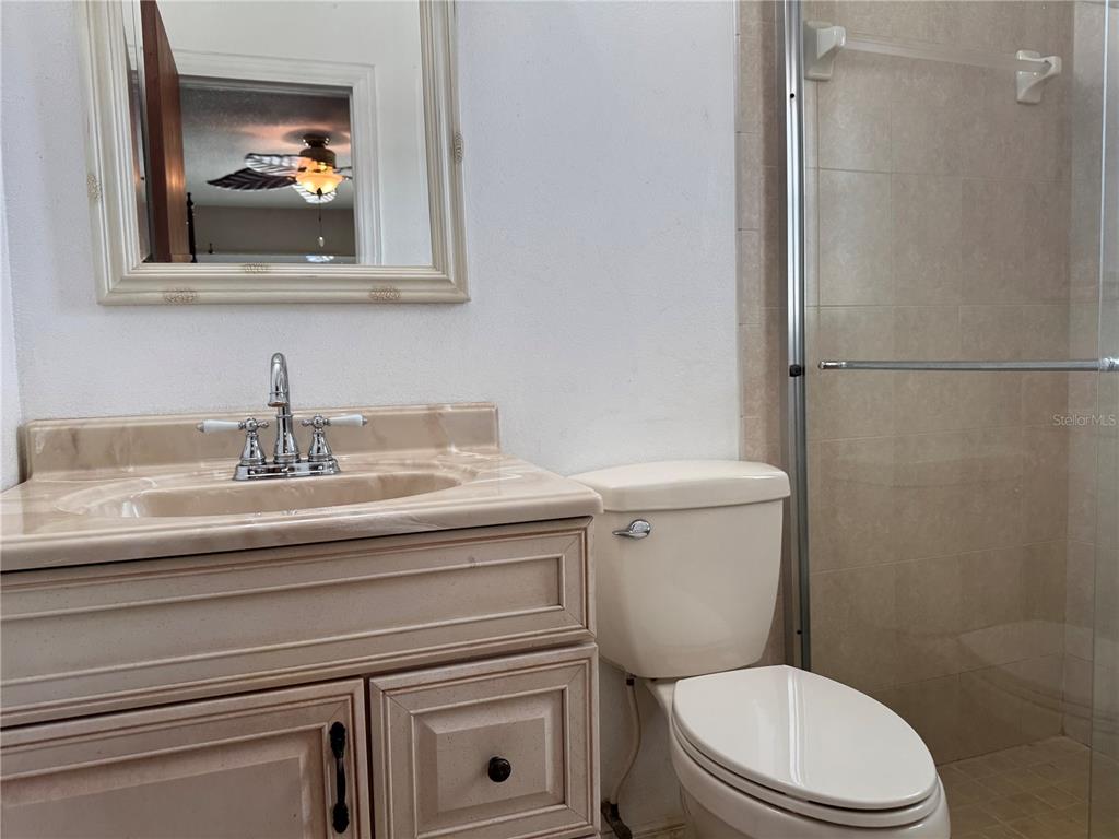 5333 Deeson Road Lakeland, FL 33810 - Photo 18 of 44 a bathroom with a toilet a sink and mirror