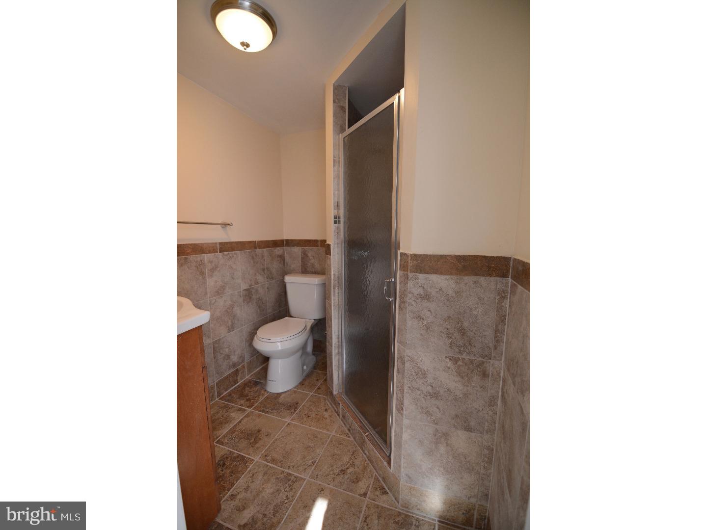 25 Merion Road Newark, DE 19713 - Photo 17 of 23 a bathroom with a toilet and a shower