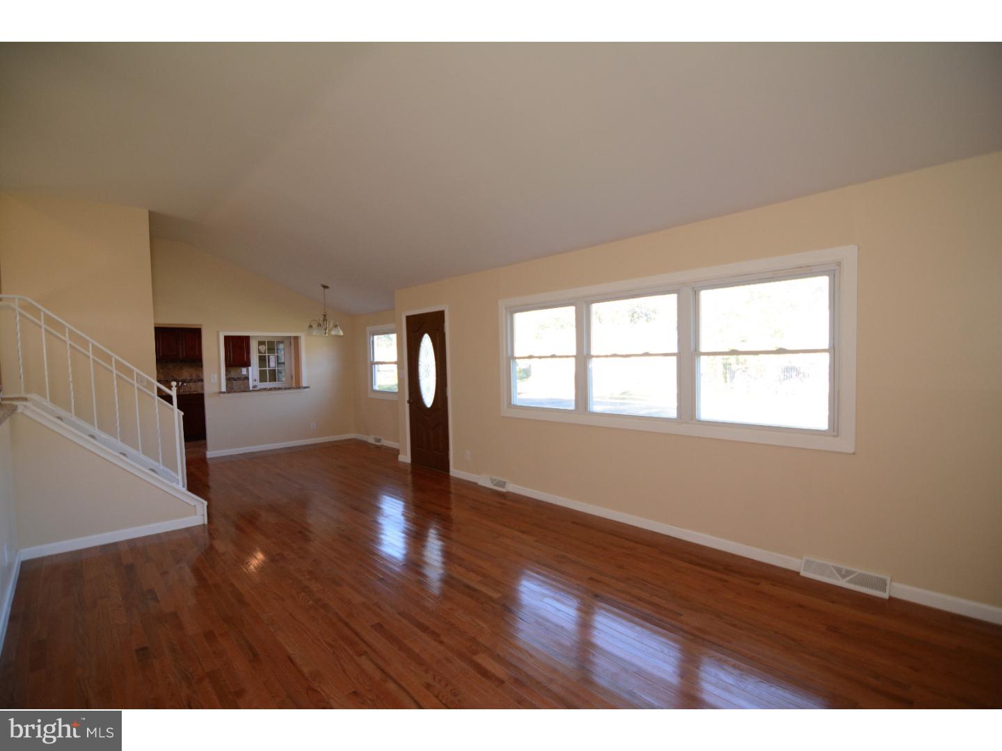 25 Merion Road Newark, DE 19713 - Photo 5 of 23 a view of an empty room with wooden floor and a window