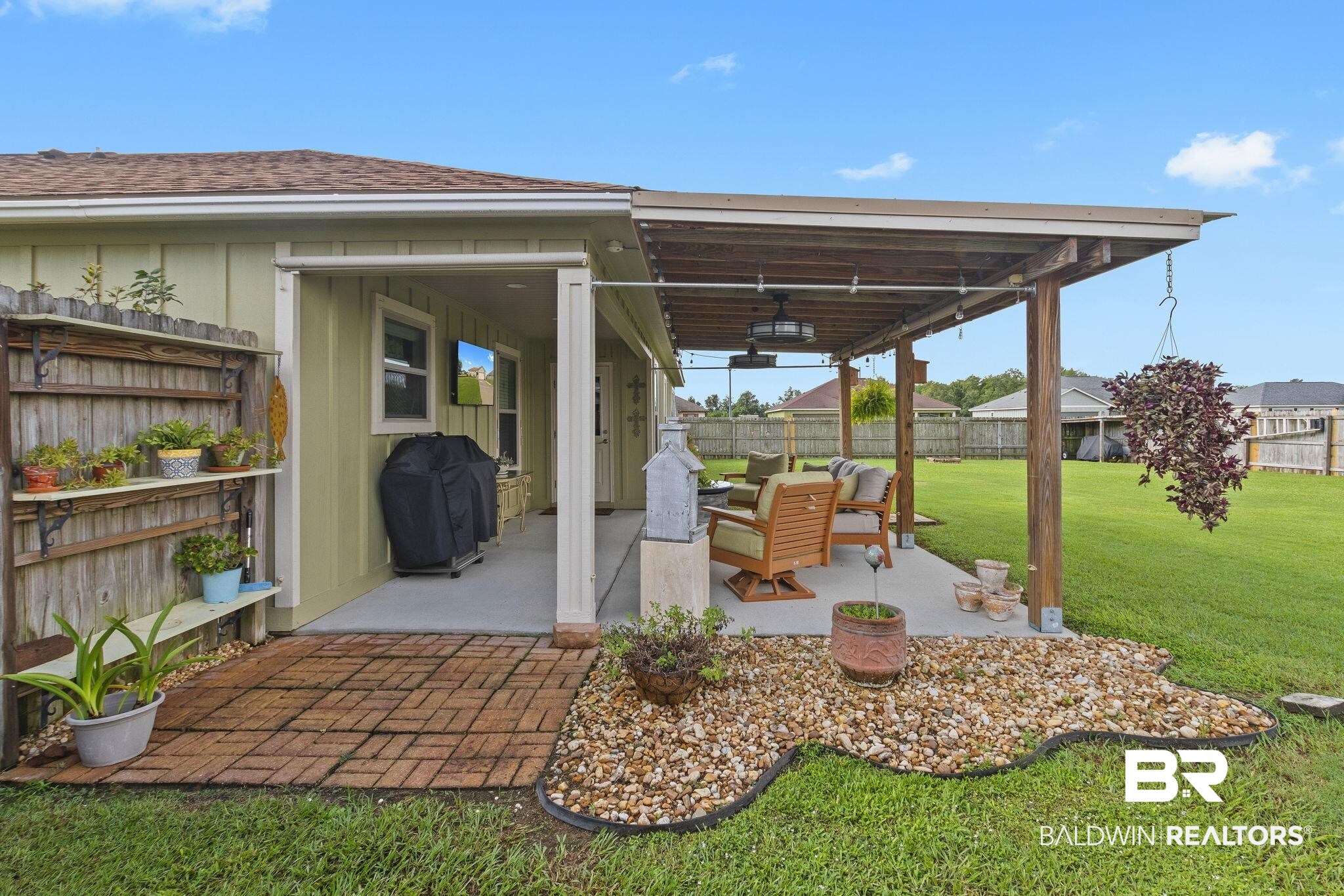 203 Lakefront Circle Summerdale, AL 36580 - Photo 67 of 69 View of patio featuring area for grilling, an outdoor living space, and ceiling fan