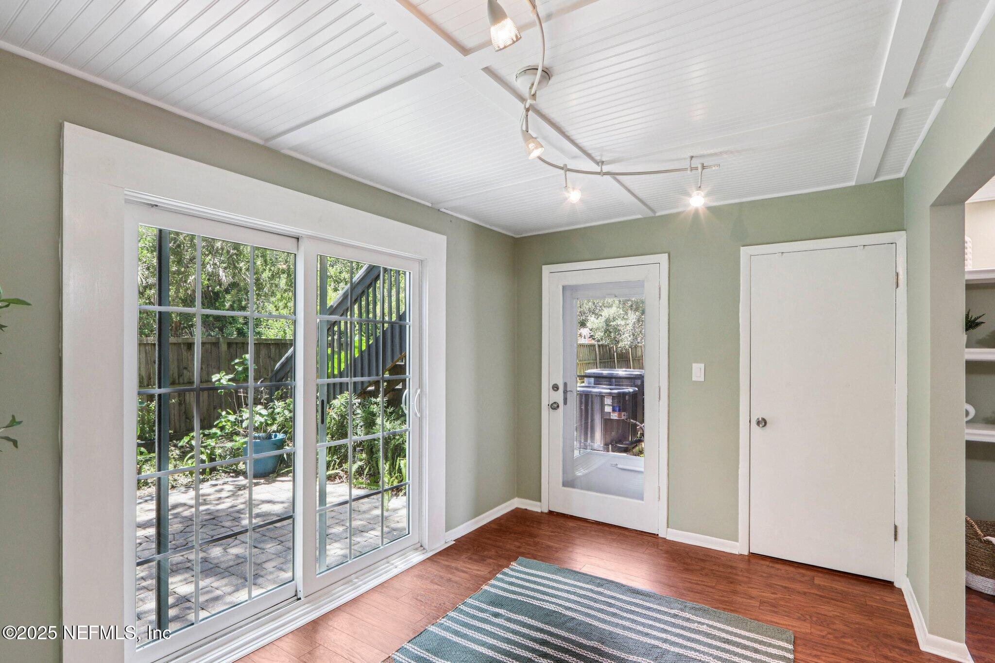 200 16th Street, Unit 103A St. Augustine Beach, FL 32080 - Photo 20 of 51 a view of an entryway with wooden floor
