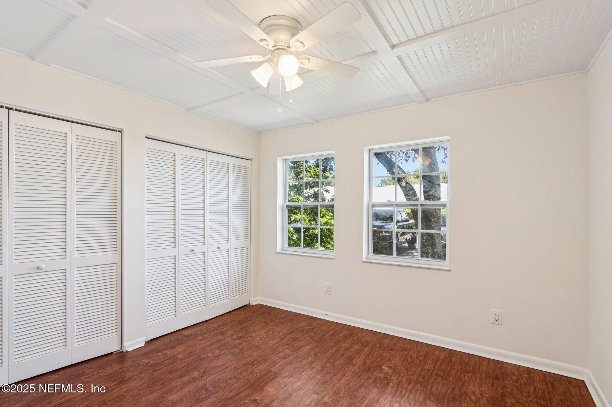 200 16th Street, Unit 103A St. Augustine Beach, FL 32080 - Photo 27 of 51 an empty room with windows and fan