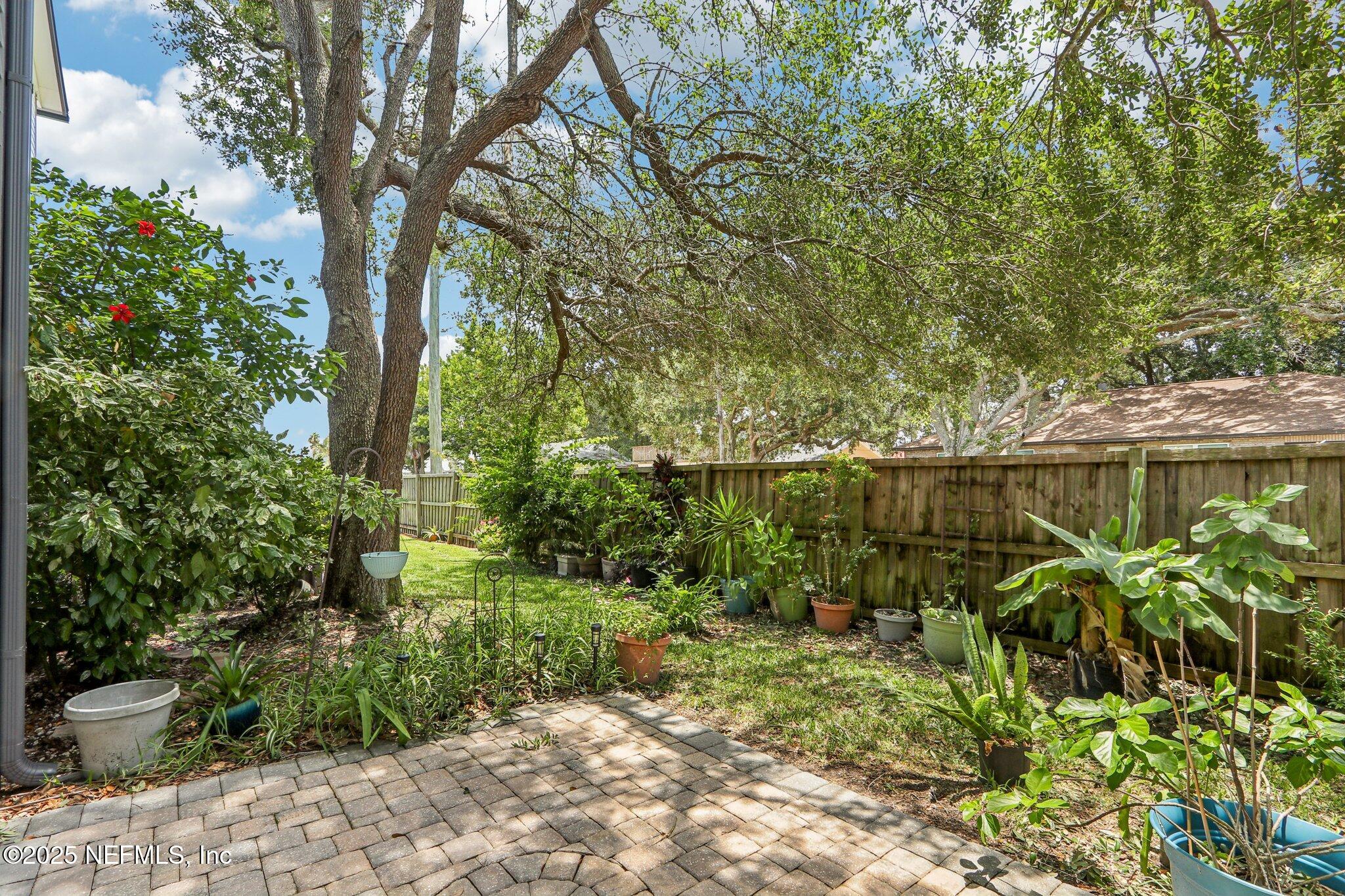 200 16th Street, Unit 103A St. Augustine Beach, FL 32080 - Photo 33 of 51 a view of a garden