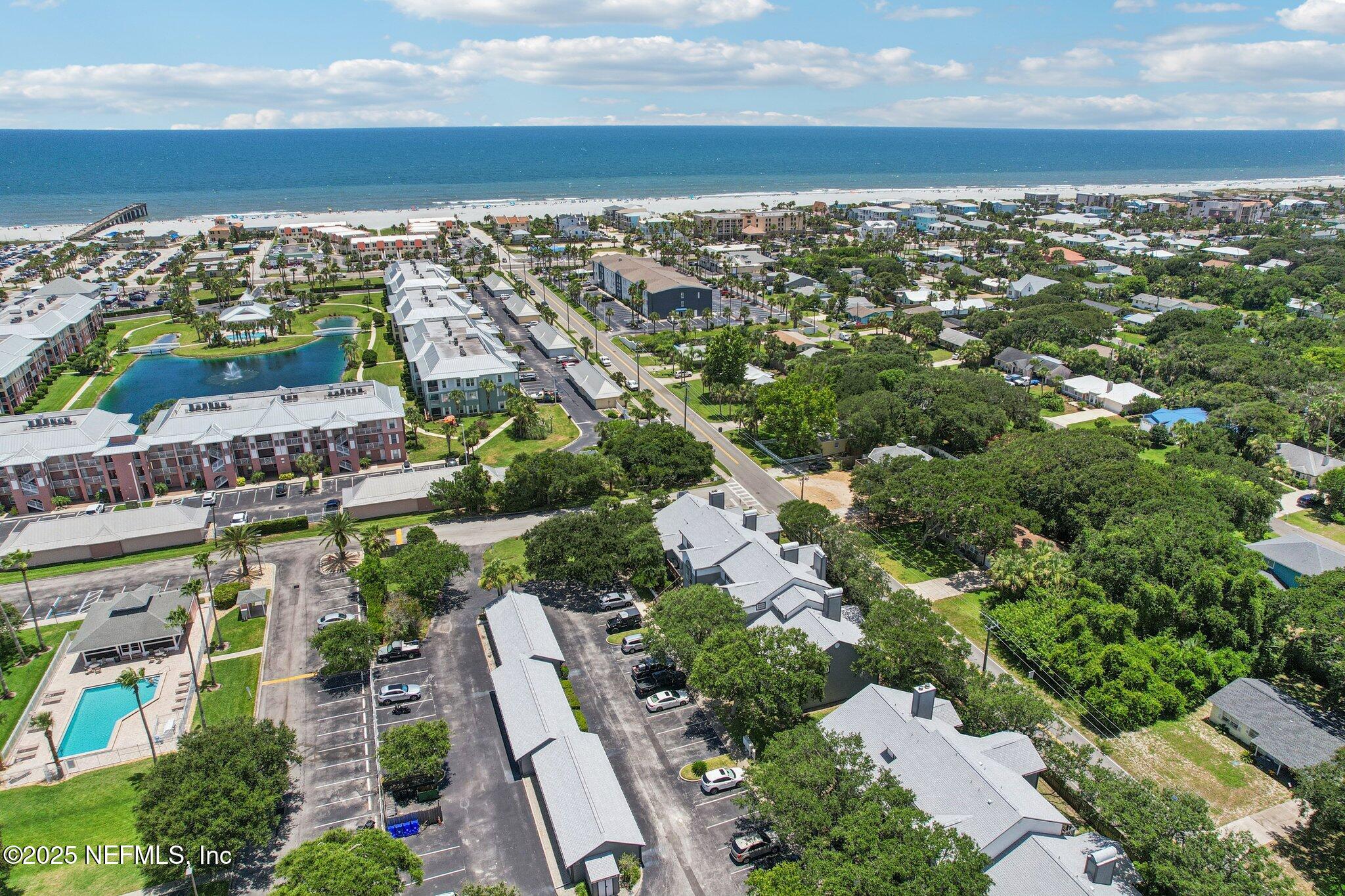200 16th Street, Unit 103A St. Augustine Beach, FL 32080 - Photo 42 of 51 an aerial view of a city with lots of residential buildings ocean and mountain view in back