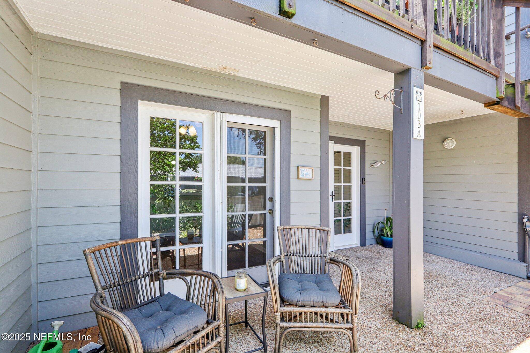 200 16th Street, Unit 103A St. Augustine Beach, FL 32080 - Photo 7 of 51 a view of a patio with couple of chairs and a potted plant