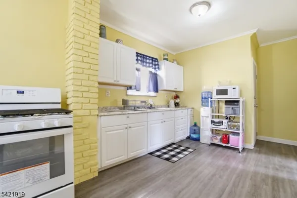 a kitchen with stainless steel appliances a stove and a refrigerator