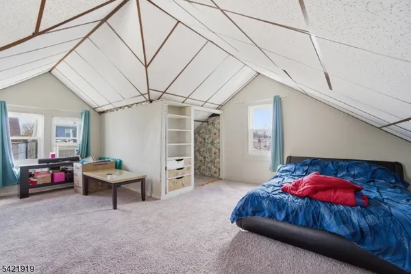 a bedroom with furniture and a bed