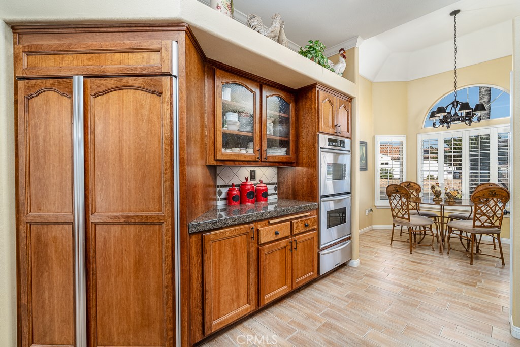 1877 Cashew Tree Street Hemet, CA 92545 - Photo 11 of 32 a view of a kitchen with furniture wooden floor and windows