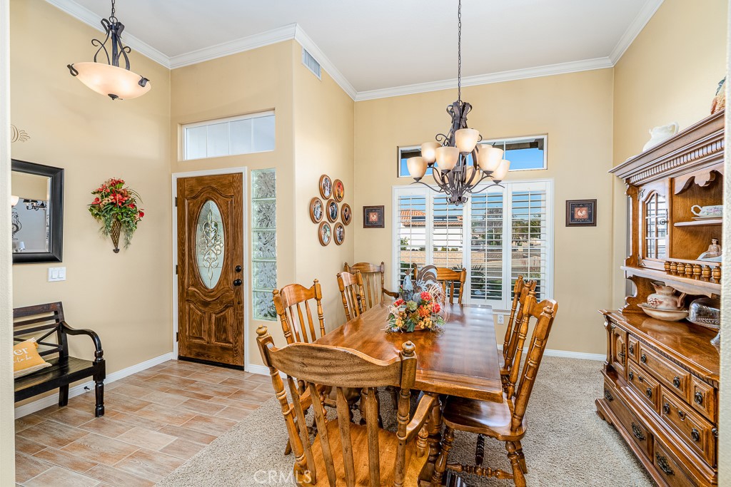 1877 Cashew Tree Street Hemet, CA 92545 - Photo 13 of 32 a dining room with furniture and window