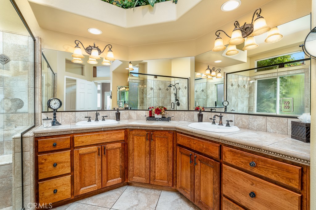 1877 Cashew Tree Street Hemet, CA 92545 - Photo 19 of 32 a spacious bathroom with a sink double vanity and a mirror