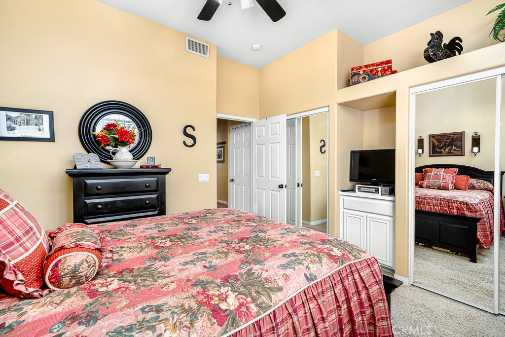 1877 Cashew Tree Street Hemet, CA 92545 - Photo 21 of 32 a bedroom with a bed and a flat screen tv