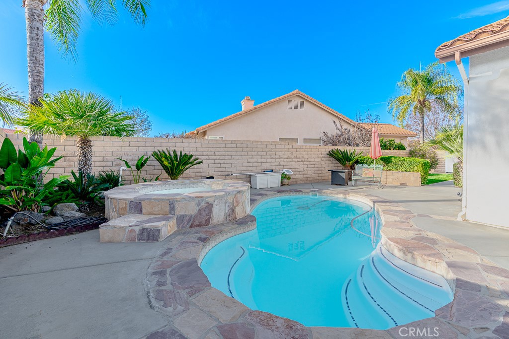 1877 Cashew Tree Street Hemet, CA 92545 - Photo 27 of 32 a view of a backyard with plants and a patio