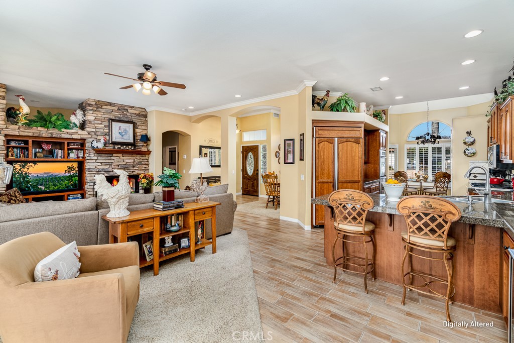 1877 Cashew Tree Street Hemet, CA 92545 - Photo 8 of 32 a living room with fireplace furniture and a flat screen tv
