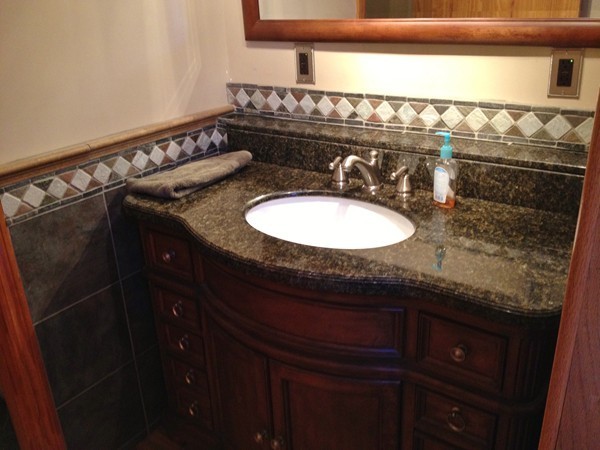 8 Old Worcester Road Westminster, MA 01473 - Photo 9 of 25 a bathroom with a granite countertop sink a mirror and vanity