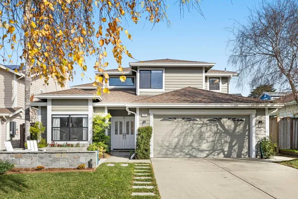 front view of a house with a yard