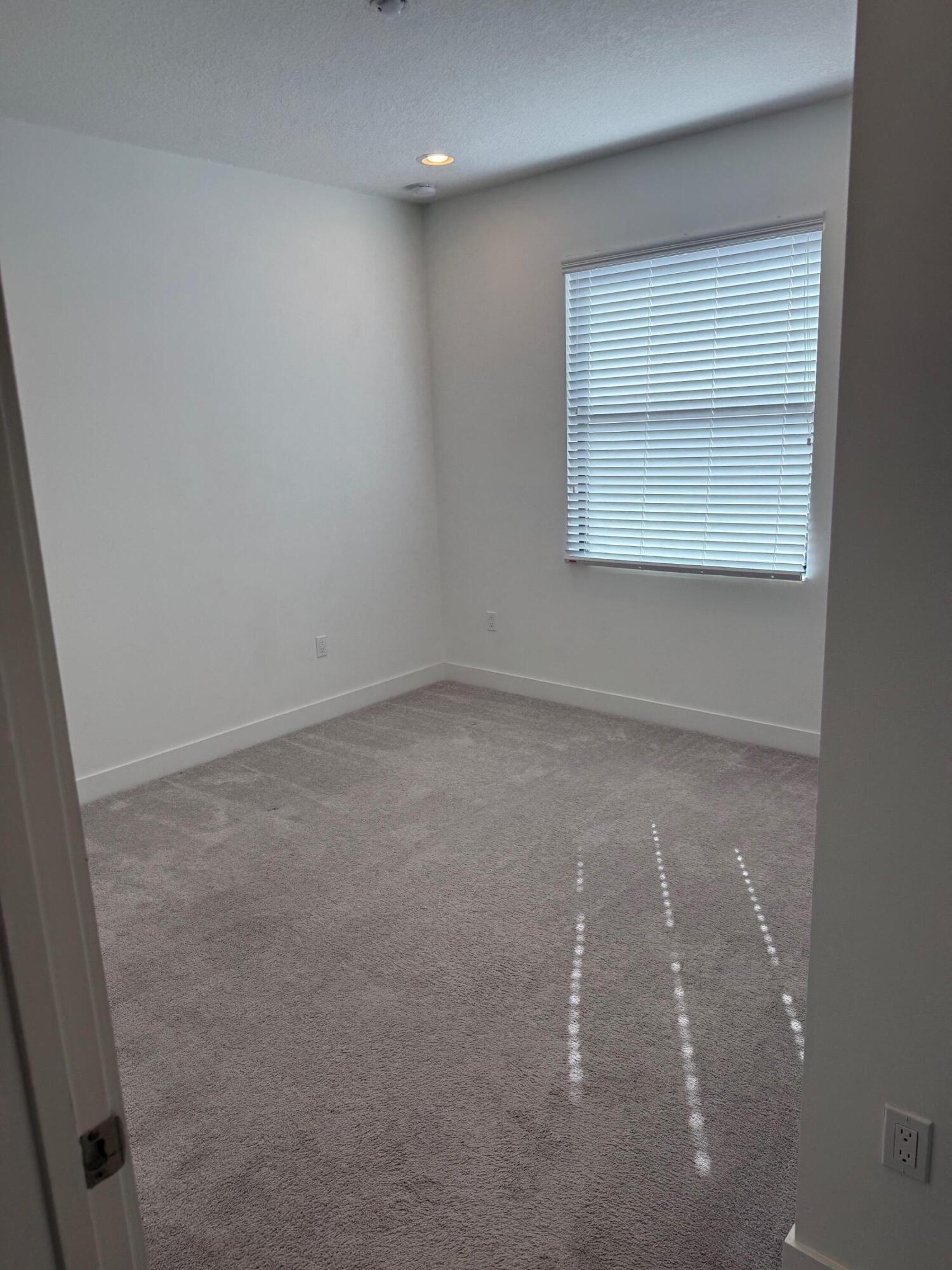 8055 White Wave Terrace Boca Raton, FL 33496 - Photo 13 of 20 an empty room with a workbench
