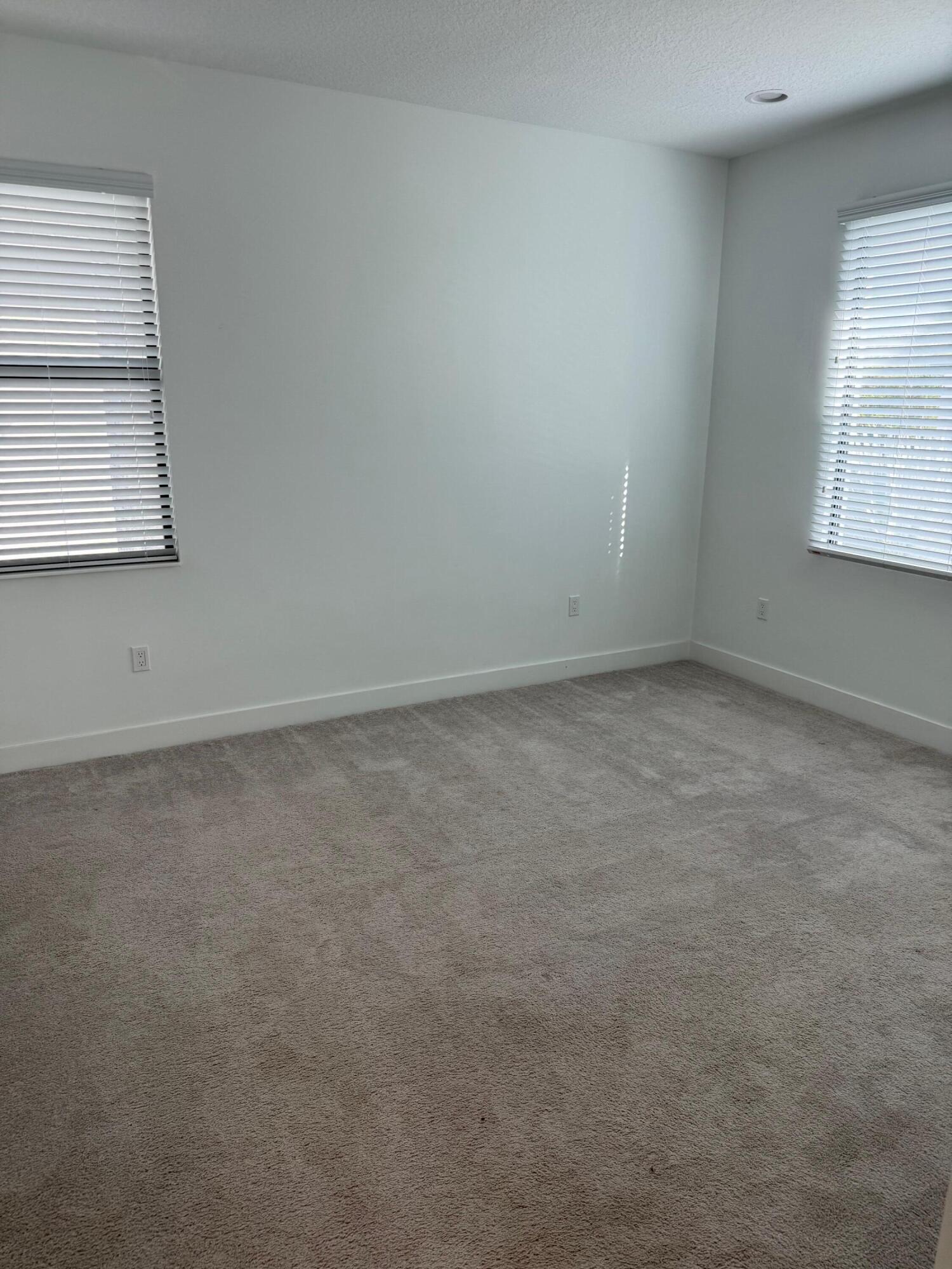 8055 White Wave Terrace Boca Raton, FL 33496 - Photo 15 of 20 an empty room with windows
