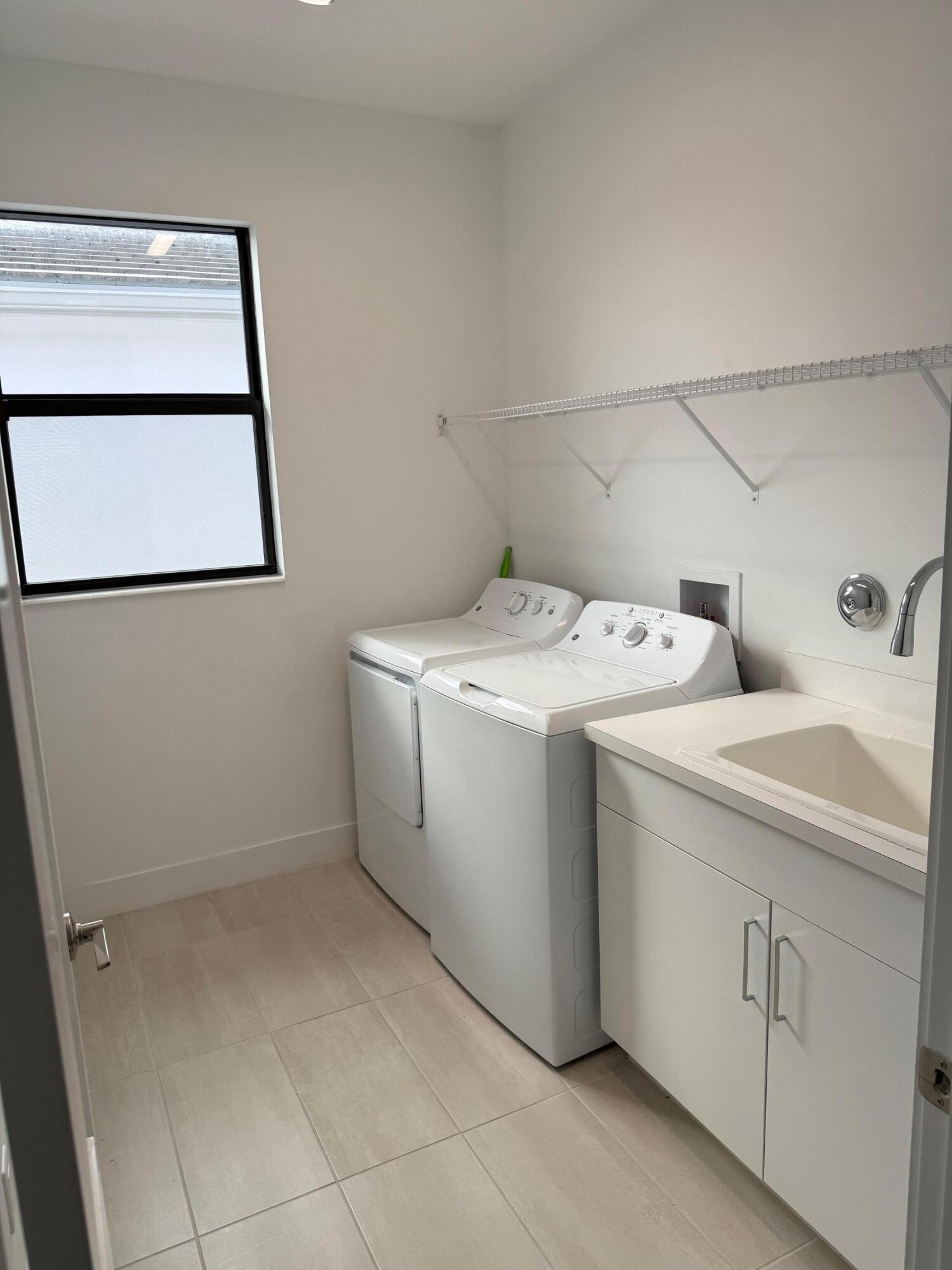 8055 White Wave Terrace Boca Raton, FL 33496 - Photo 18 of 22 Laundry 2nd floor