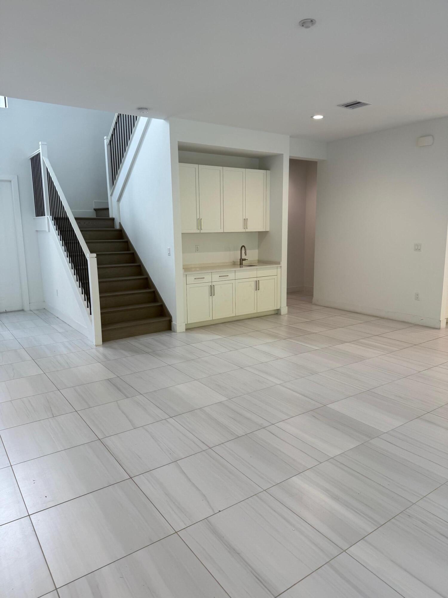 8055 White Wave Terrace Boca Raton, FL 33496 - Photo 3 of 20 a view of an empty room with a window