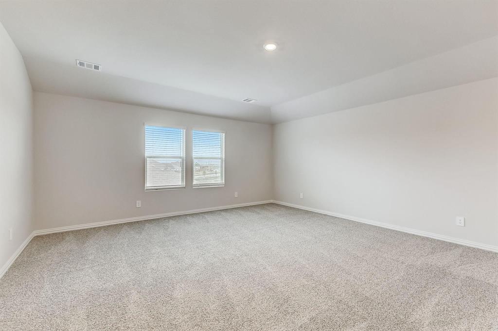 1405 Winters Way McKinney, TX 75071 - Photo 28 of 32 Spare room with carpet