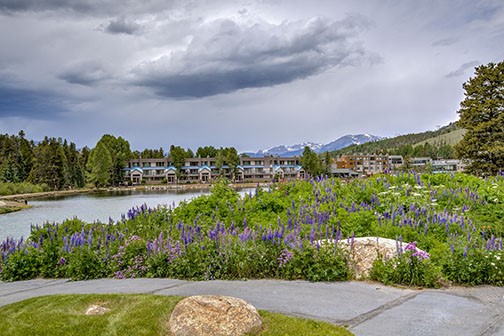 22340 Highway 6, Unit 1785 Keystone, CO 80435 - Photo 25 of 28 a view of a lake with a garden