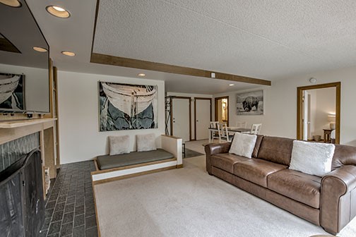 22340 Highway 6, Unit 1785 Keystone, CO 80435 - Photo 5 of 28 a living room with furniture and a fireplace