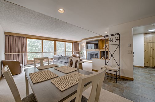 22340 Highway 6, Unit 1785 Keystone, CO 80435 - Photo 6 of 28 a living room with furniture and a floor to ceiling window