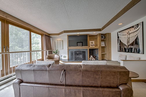 22340 Highway 6, Unit 1785 Keystone, CO 80435 - Photo 7 of 28 a living room with furniture a flat screen tv and a large window