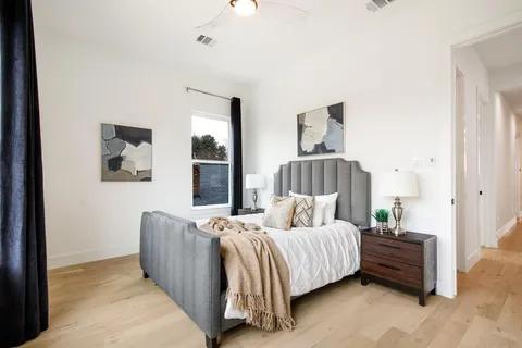 a bedroom with a bed and a couch