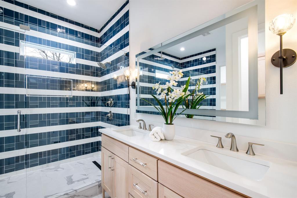 807 South Glasgow Drive Dallas, TX 75223 - Photo 6 of 39 a bathroom with a sink and a mirror