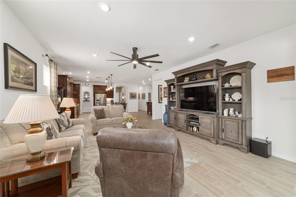 6479 Southwest 94th Circle Ocala, FL 34481 - Photo 13 of 82 a living room with furniture and a flat screen tv