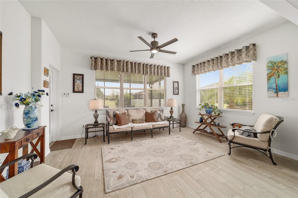 6479 Southwest 94th Circle Ocala, FL 34481 - Photo 14 of 82 a living room with furniture and a large window
