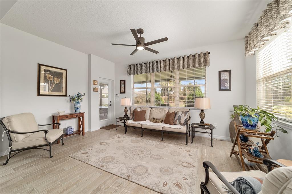 6479 Southwest 94th Circle Ocala, FL 34481 - Photo 15 of 82 a living room with furniture and a large window
