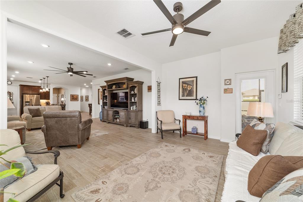 6479 Southwest 94th Circle Ocala, FL 34481 - Photo 16 of 82 a living room with furniture and a flat screen tv