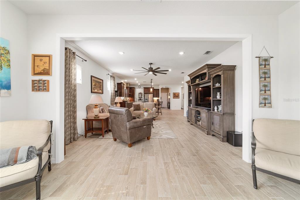6479 Southwest 94th Circle Ocala, FL 34481 - Photo 17 of 82 a living room with furniture and a wooden floor