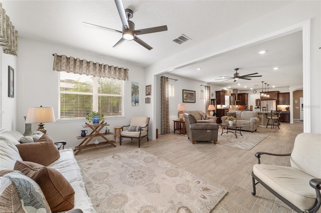 6479 Southwest 94th Circle Ocala, FL 34481 - Photo 18 of 82 a living room with furniture and a large window