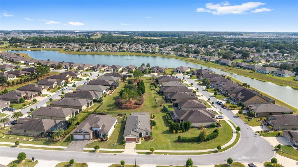 6479 Southwest 94th Circle Ocala, FL 34481 - Photo 2 of 82 an aerial view of residential houses with outdoor space and river
