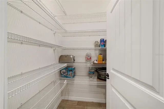 a bedroom with a bed and a lamp