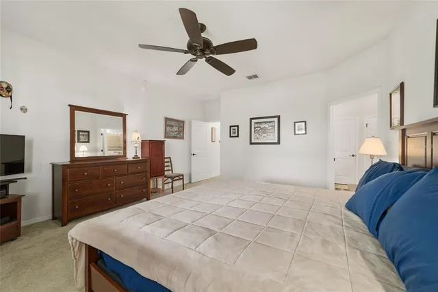 a view of a livingroom with workspace and a couch